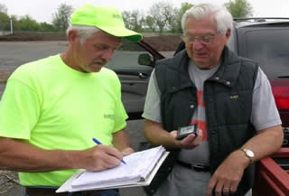 Larry (left) verifying proof of township residency (driver’s license is acceptable)